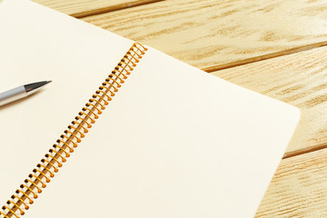 open notepad on wooden background