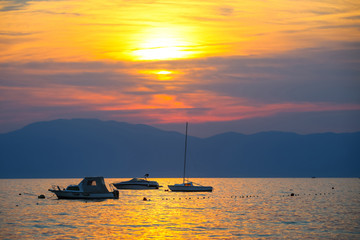 Sunset with boats at sea