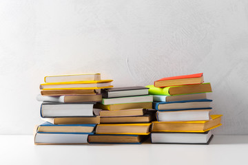  pile of paperback books on a table