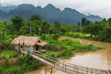 Fototapeta na wymiar village hut near river in vangvieng laos