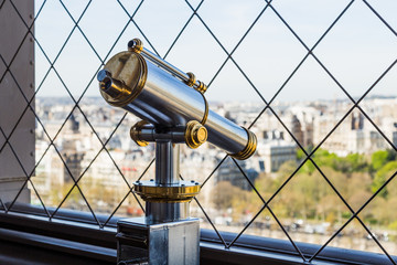 Paris, France - March 30, 2017: A bright and shiny telescope on the Eiffel Tower