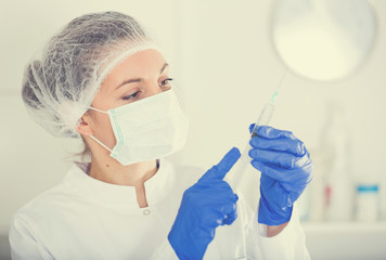 Nurse making injection