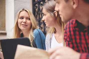 Friend meeting on stairs outside