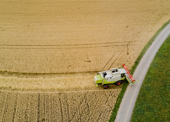 Aerial view of combine harvester  on a field