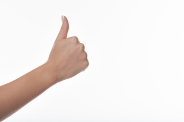 Woman hand with thumb up isolated on white background