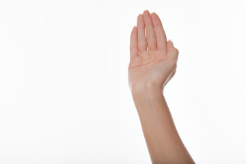 female hand with raised up fingers and deployed forward palm