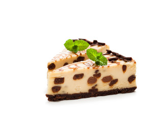 Baked  white and dark chocolate cheese cake isolated on white