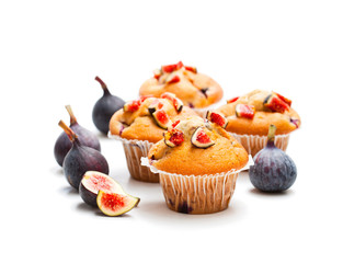 Baked  muffins with figs isolated on white