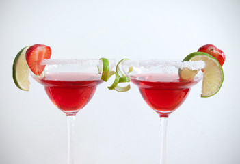 Red cocktails beverages over a white background