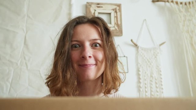 Happy girl with big papper box. surpise. slowmotion