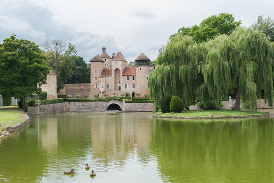 Chateau de Sercy in Burgundy, France, beautiful castle with a lake
