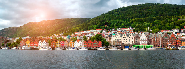 Panoramic Famous Bryggen street with wooden colored houses in Bergen, Norway, UNESCO world heritage cite - architecture background - obrazy, fototapety, plakaty