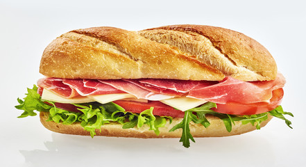 Fresh baguette sandwich with ham and vegetables
