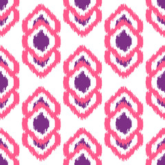 Ikat geometric seamless pattern. Pink and violet color collection. Indonesian textile fabric tie-dye technique inspiration. Rhombus and drop shapes.