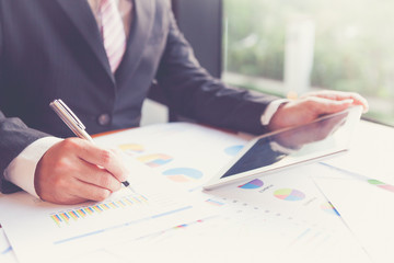 Young businessmen using pan and touchpad
