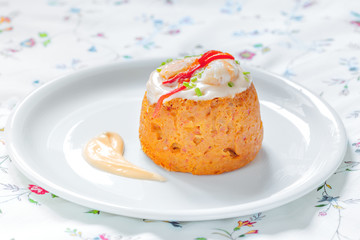 Delicious spanish Fish cake. Hake cake with tuna, tomato, shrimps, chive and salad cream.