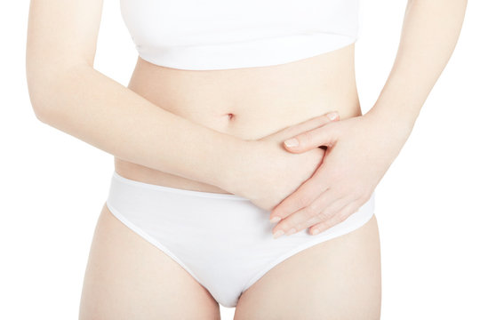 Woman with abdominal pain isolated on white, clipping path