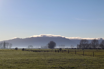 Misty mountain silhouettes in New Zealand 
