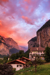Amazing sunset in the Swiss village of Lauterbrunnen with the Staubbach Falls in the background © dennisvdwater