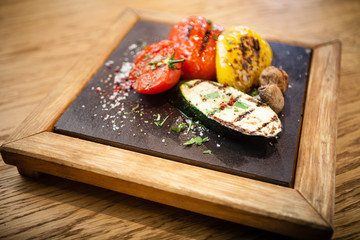 Grilled vegetables on a stone board