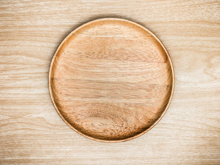Wooden cutlery on wooden background. Top view