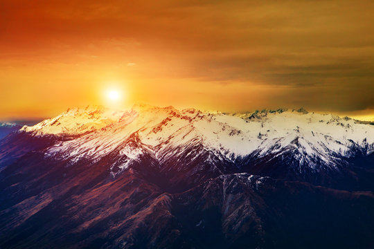 Fototapeta beautiful landscape sun rising sky over snowcaped mountain