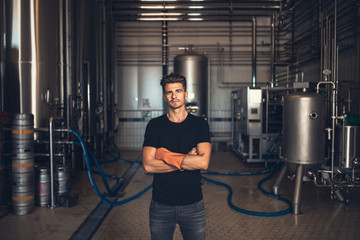 Worker with industrial equipment at the brewery.
