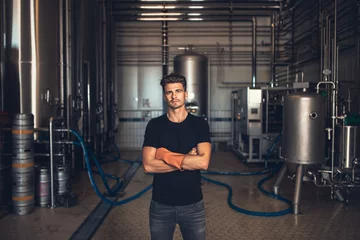 Fotobehang Worker with industrial equipment at the brewery. © Jacob Lund