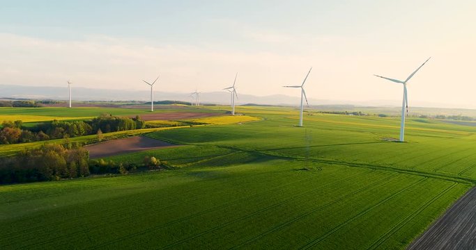 AGRICULTURE - Aerial view of summer countryside with wind turbines