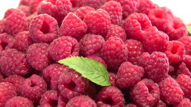 Raspberry. Juicy fresh Raspberry on a white background rotates. Raspberries is spinning 360. Looping is possible. High speed camera shot. Full HD 1080p.