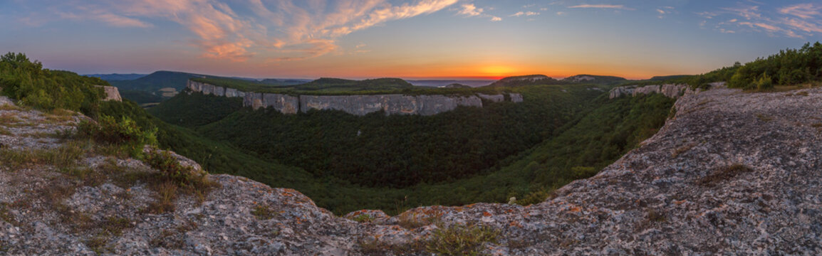 View from the Kyz-Kermen plateau to the slope of an adjacent plateau in the Crimean mountains at sunset