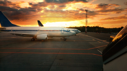 Fototapeta na wymiar Airplane at sunset - back lit
