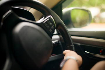 Obraz na płótnie Canvas Blurred hand driving in the car.
