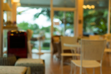 cafe coffee shop interior decoration with warm light, abstract blur background