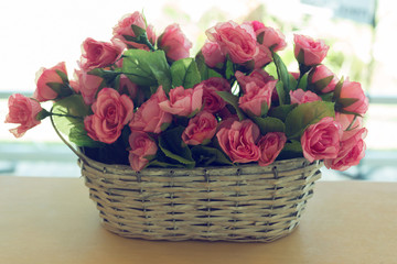 Fototapeta na wymiar beautiful bouquet rose pink flower artificial in basket