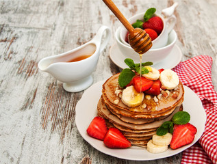 Pancakes with strawberries and bananas