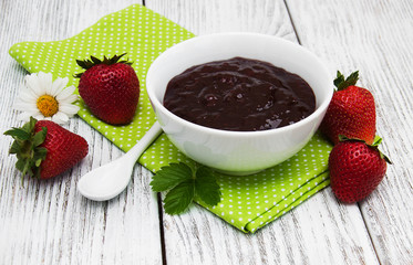 Strawberry jam and fresh strawberries