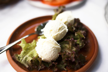 Plate with cheese kaimak on the table