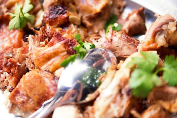 Pieces of meat in an iron plate