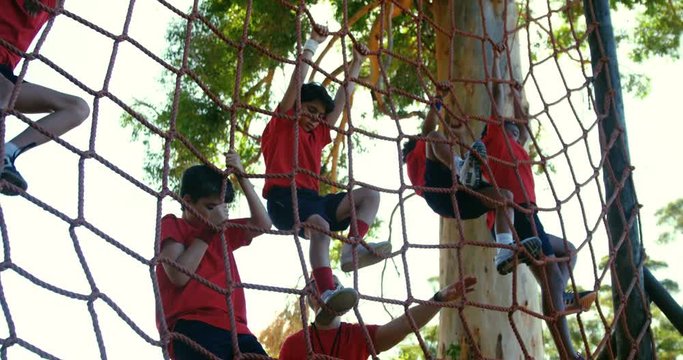 Trainer training kids in the boot camp