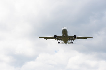 Fototapeta na wymiar Passenger airplane in the clouds