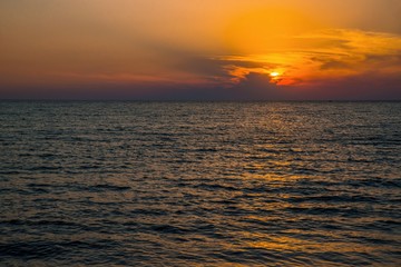 Fototapeta premium Orange sunset above Aegean sea, island Lemnos.