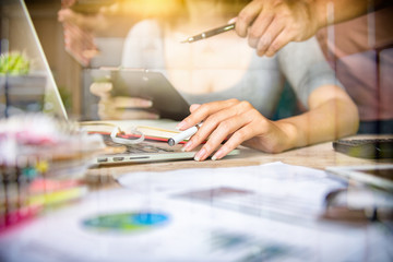 Business team meeting. Photo professional investor working new start up project. Finance task.Digital tablet docking keyboard laptop computer smart phone using