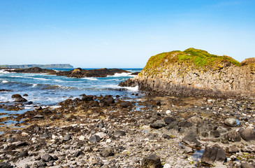Rocks, cliffs, waves and breakers at Ballintoy harbor, Northern coast of County Antrim, Northern...
