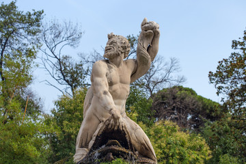 GENOA (GENOVA) ITALY, JULY, 19, 2017 - Triton statue in the the garden of the Prince's Palace,...