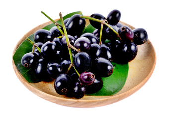 Jambolan plum in wood plate isolated on white background