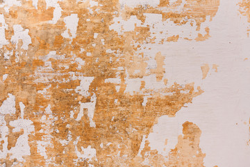 Chipped paint on old wall background - Old cement plastered wall that has chipped paint.