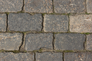 Ancient paving road in the center of the city close up