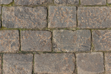 Ancient paving road in the center of the city close up