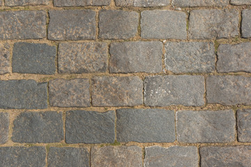 Olden cobblestone pavement close up